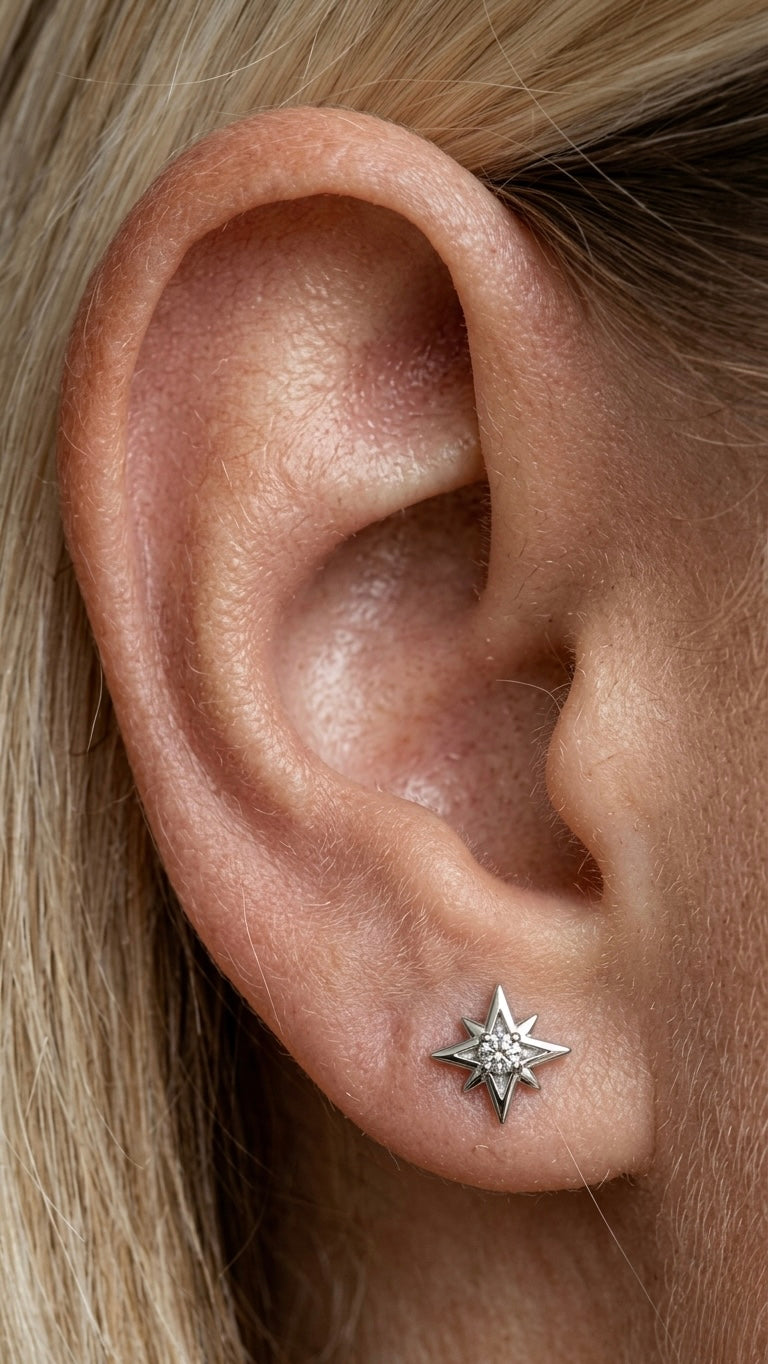 עגיל פירסינג טיטניום/ בציפוי זהב 14 קראט בצורת נצנץ משובץ בזרקון